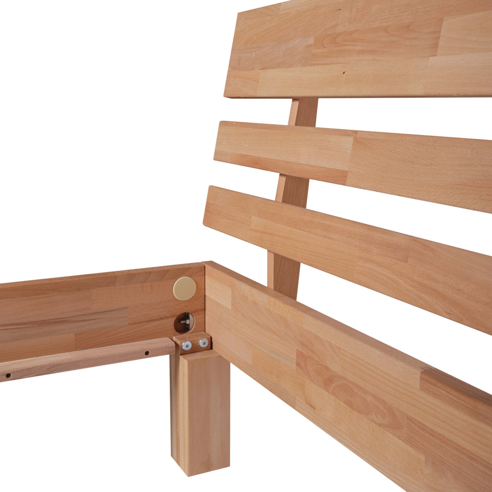 Wooden bed frame corner with visible screws 