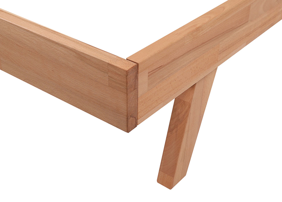 Close-up of a wooden bed frame corner 