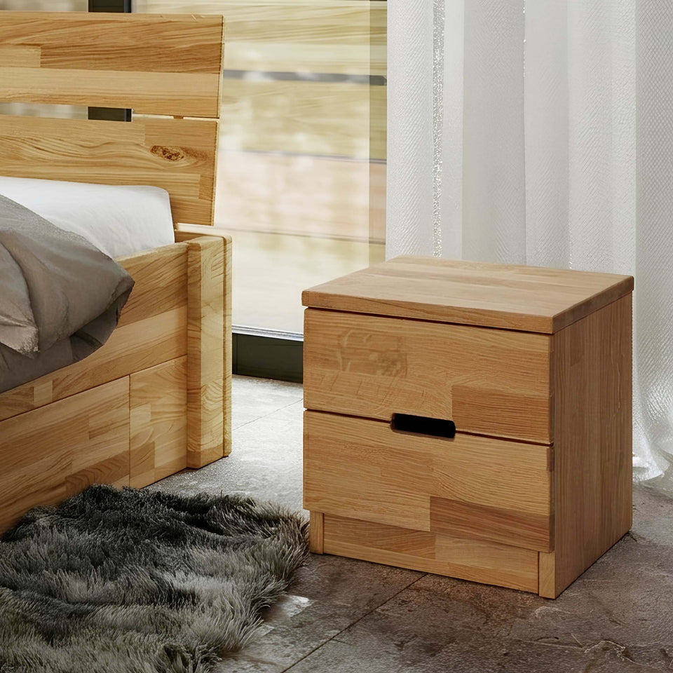 Wooden oak bedside table in a bedroom