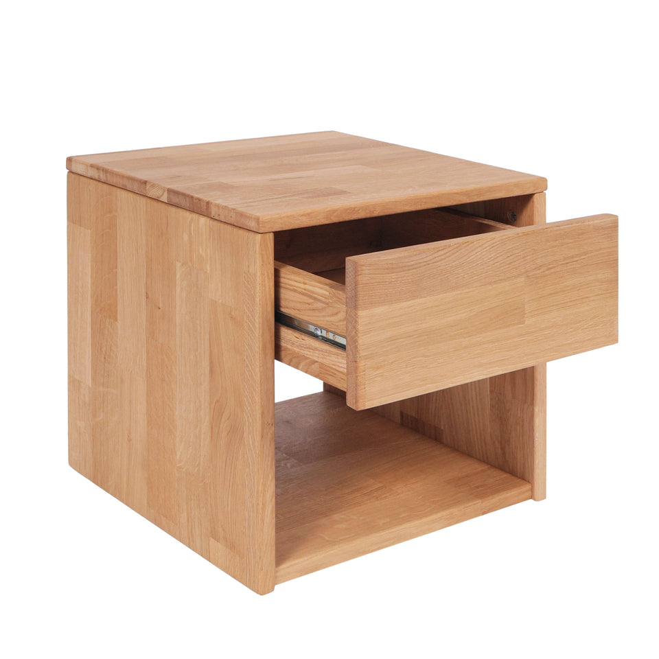 Oak wood bedside table with partially open drawer