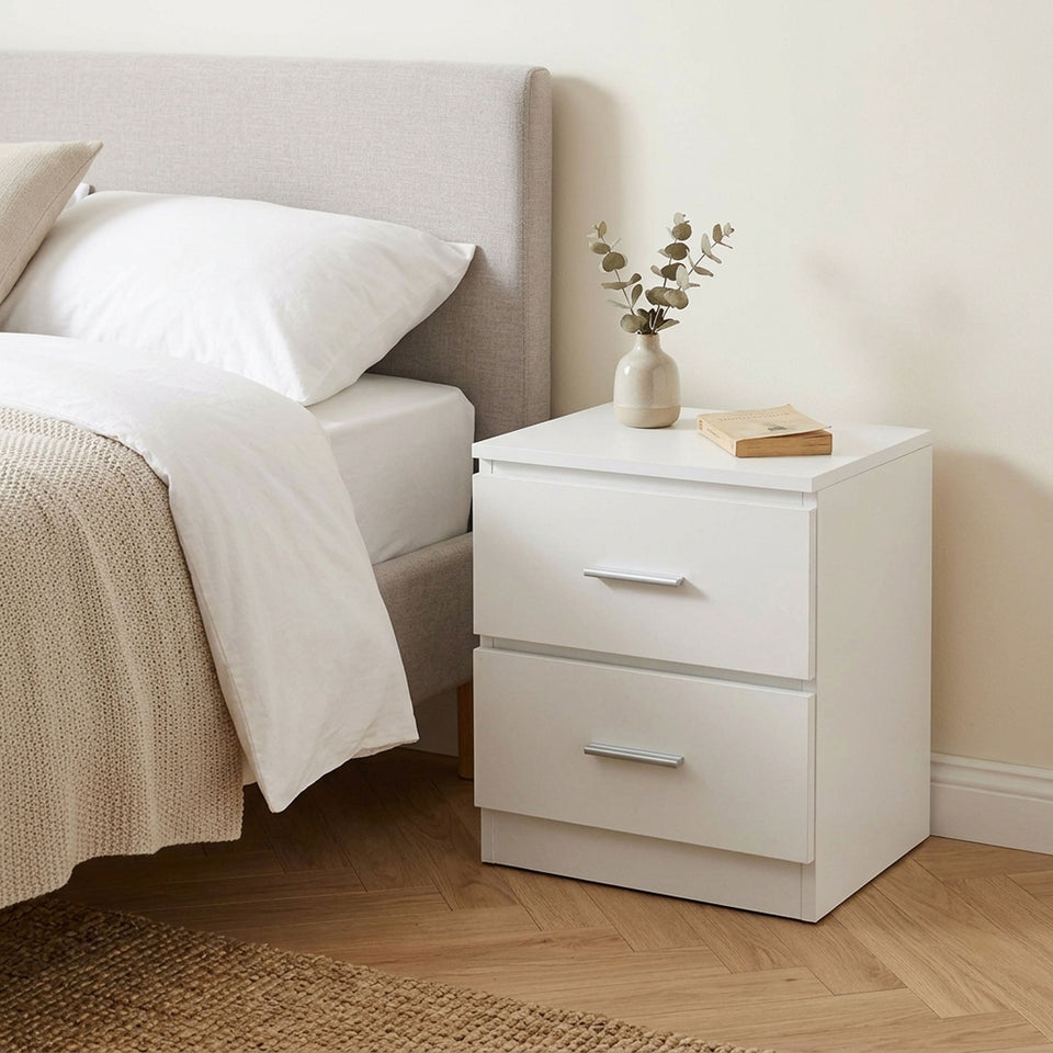 White LORA bedside table with 2 drawers beside the bed