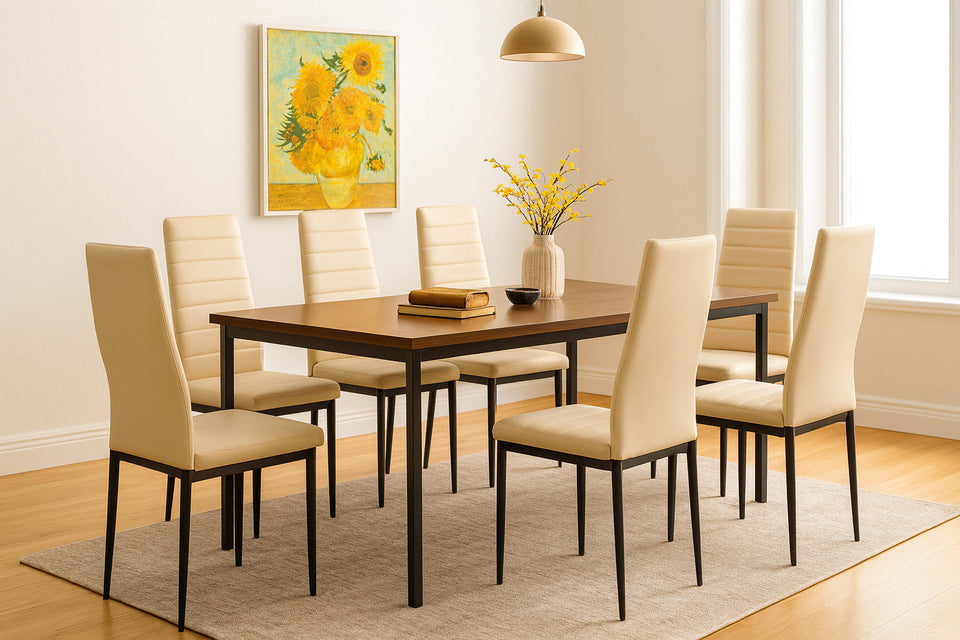 Dining room with a wooden table and beige chairs, featuring a painting of flowers on the wall.