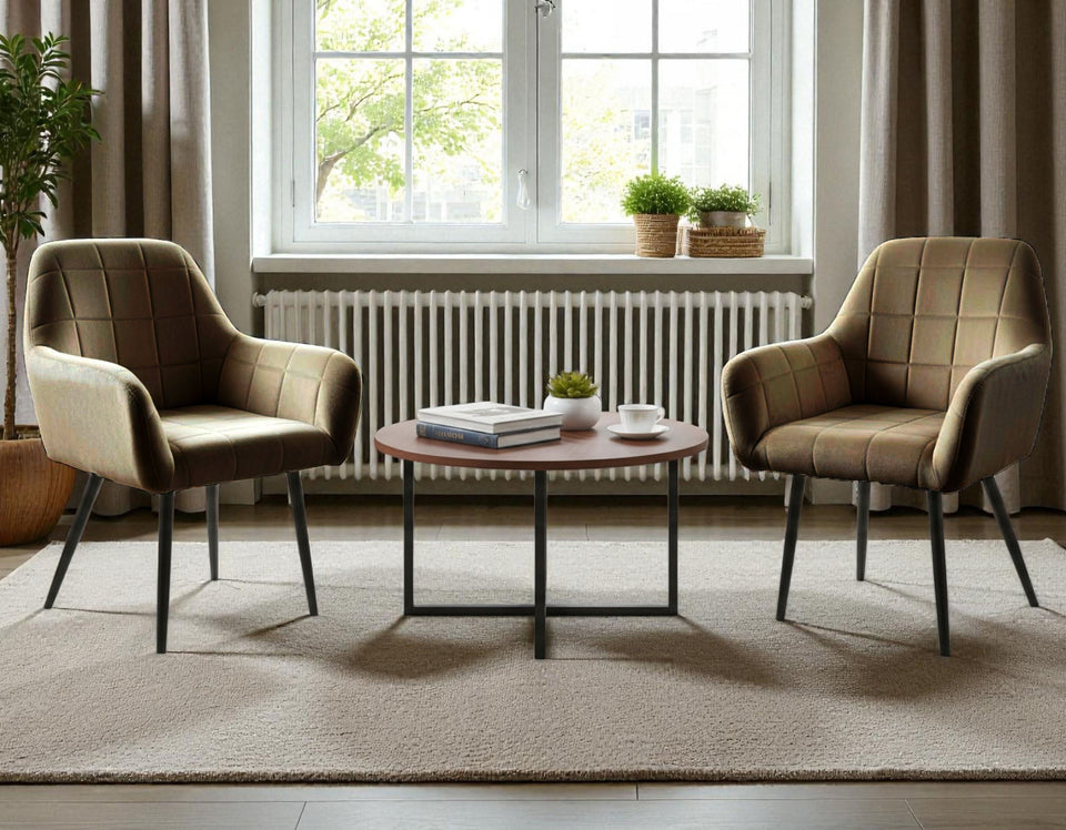 Two Wilhelm armchairs in dark brown with a round coffee table in a modern living room